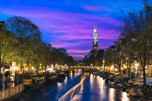 Canals of Amsterdam at night in Netherlands. Amsterdam is the capital and most populous city of the Netherlands.