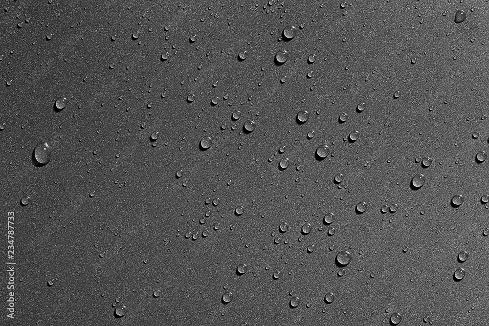 Water drops on black background, top view Water drops on black background, top view
