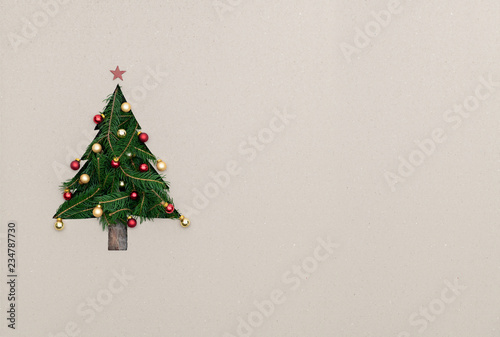 Text or logo empty copy space in vertical top view cardboard with natural eco decorated christmas tree pine.Xmas winter holiday season party social media card background 