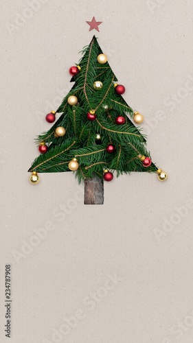 Text or logo empty copy space in vertical top view cardboard with natural eco decorated christmas tree pine.Xmas winter holiday season party social media card background 