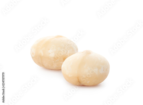 Shelled organic Macadamia nuts on white background