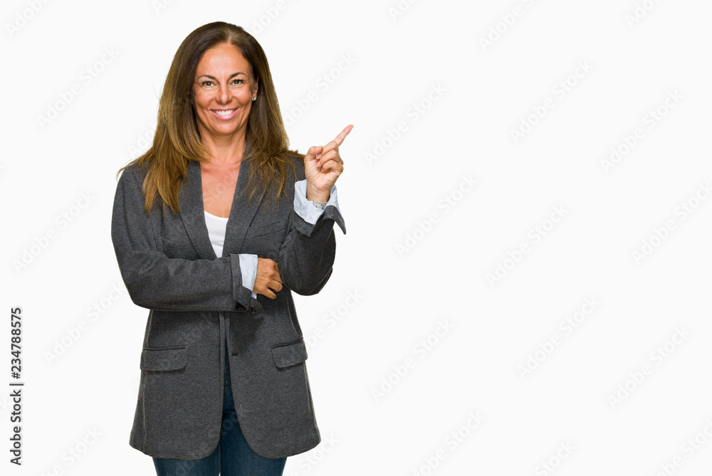 Middle age adult woman wearing oversize boyfriend jacket over isolated background with a big smile on face, pointing with hand and finger to the side looking at the camera. Middle age adult woman wearing oversize boyfriend jacket over isolated background with a big smile on face, pointing with hand and finger to the side looking at the camera.