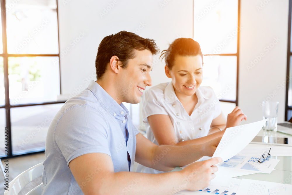 Fototapeta premium Image of two young business people in office