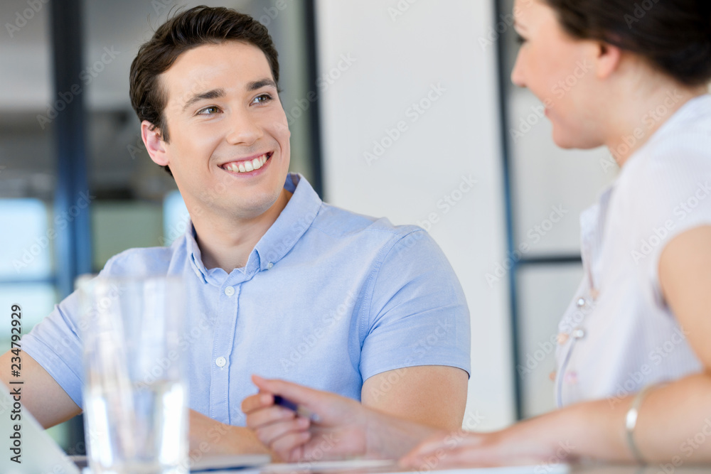Fototapeta premium Image of two young business people in office