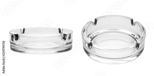 Round glass ashtray isolated on white background photo