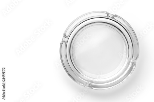 Round glass ashtray isolated on white background. Top view. photo