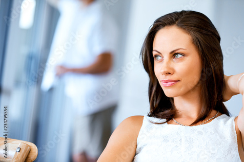 Happy young woman with cup of tea or coffee