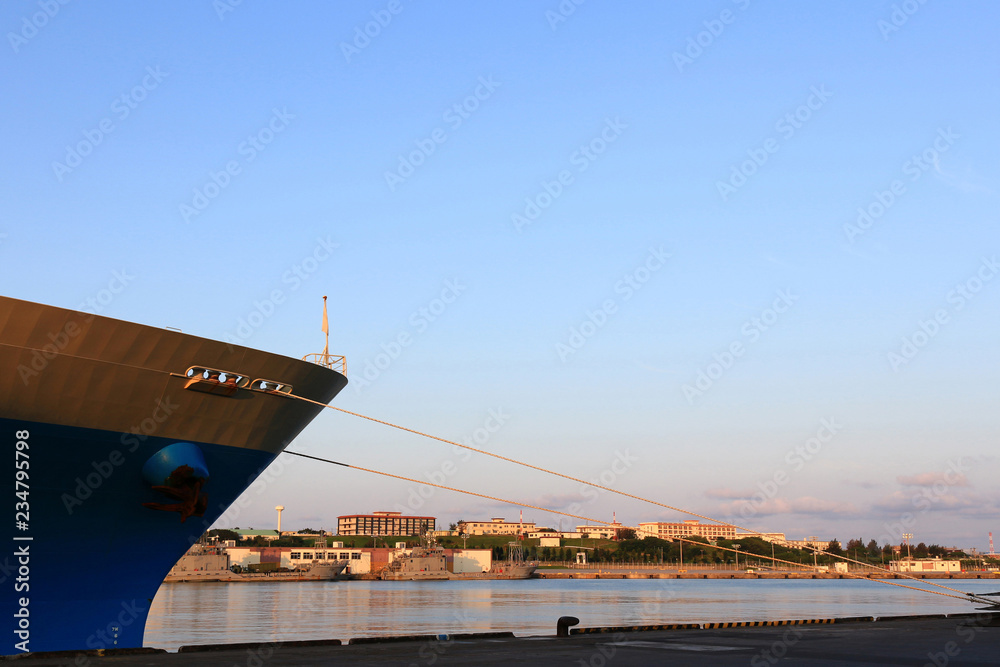 A ship moored in an early morning harbor
