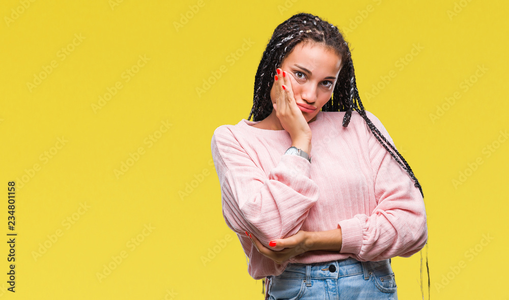 Young braided hair african american girl wearing sweater over isolated background thinking looking tired and bored with depression problems with crossed arms. Young braided hair african american girl wearing sweater over isolated background thinking looking tired and bored with depression problems with crossed arms.