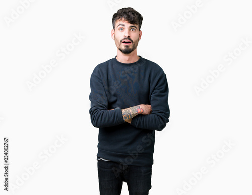 Young handsome man over isolated background afraid and shocked with surprise expression, fear and excited face.