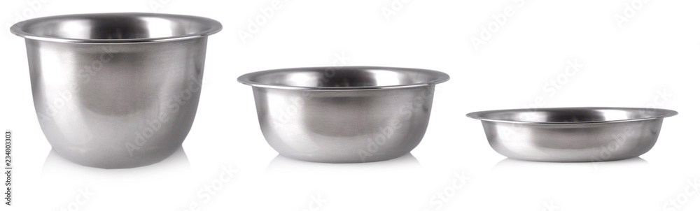 The three empty silver plates on white background. The three empty silver plates on white background.