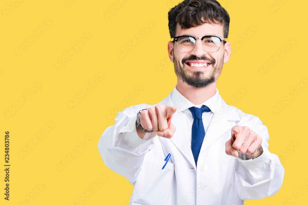 Young professional scientist man wearing white coat over isolated background Pointing to you and the camera with fingers, smiling positive and cheerful Young professional scientist man wearing white coat over isolated background Pointing to you and the camera with fingers, smiling positive and cheerful