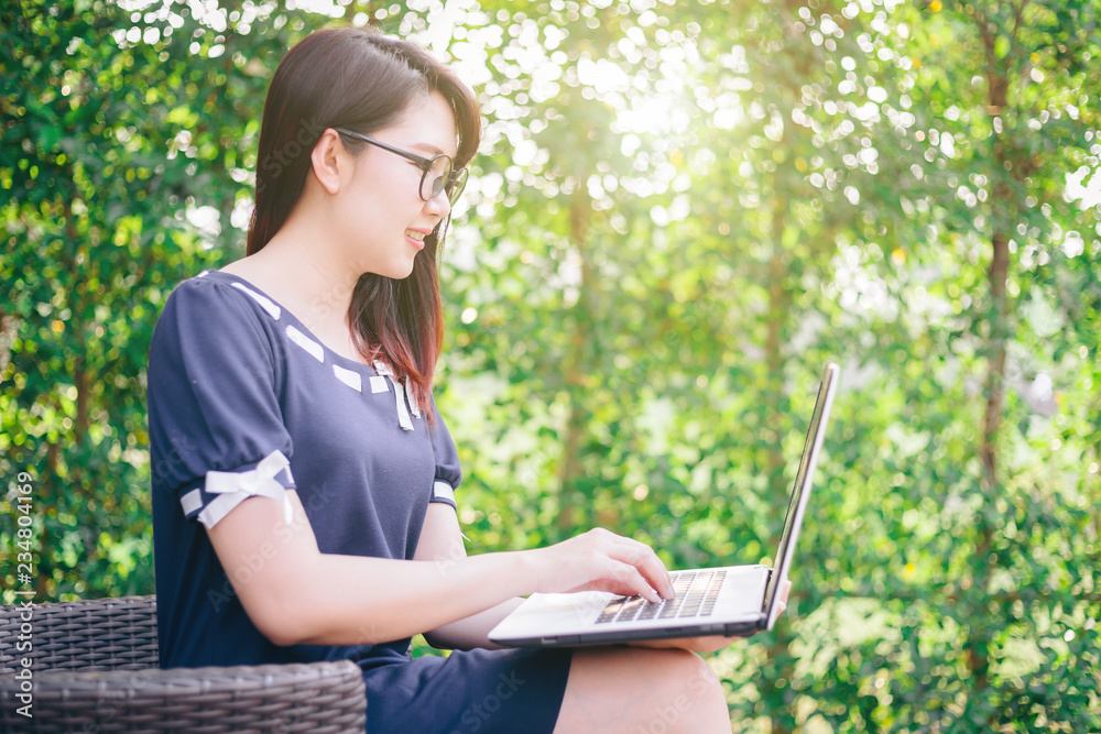 Business Asian woman working with laptop computer on office outdoor. Business Asian woman working with laptop computer on office outdoor.