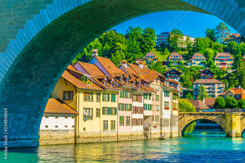 Traditional houses in Bern mirroring in Aare river, Switzerland photo