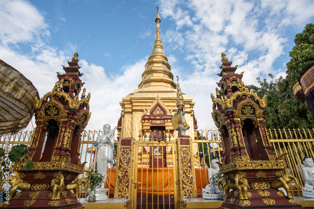 The golden pagoda of Wat Phra That Doi Wao located on the mountains peak in Mae Sai district nearly the border between Thailand and Myanmar. The temple is the perfect spot for border view.