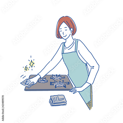 コンロを拭く女性　イラスト