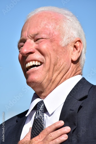 Businessman And Laughter Wearing Suit Isolated