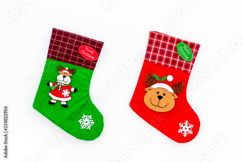 Christmas socks. Traditional decorative socks for small gifts on white background top view
