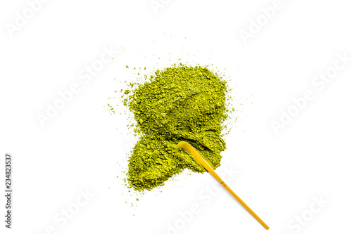 Pile of Matcha powder and specail stick on white background top view copy space