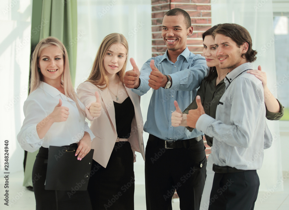 portrait of modern business team showing thumb up portrait of modern business team showing thumb up
