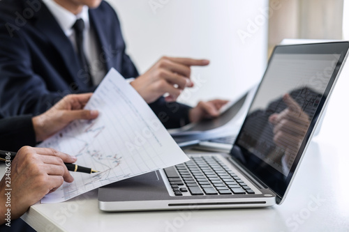Business team investment working with computer and analysis graph stock market trading with stock chart data, business and technology concept