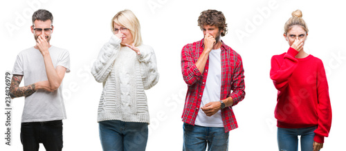 Collage of group of young people over white isolated background smelling something stinky and disgusting, intolerable smell, holding breath with fingers on nose. Bad smells concept.
