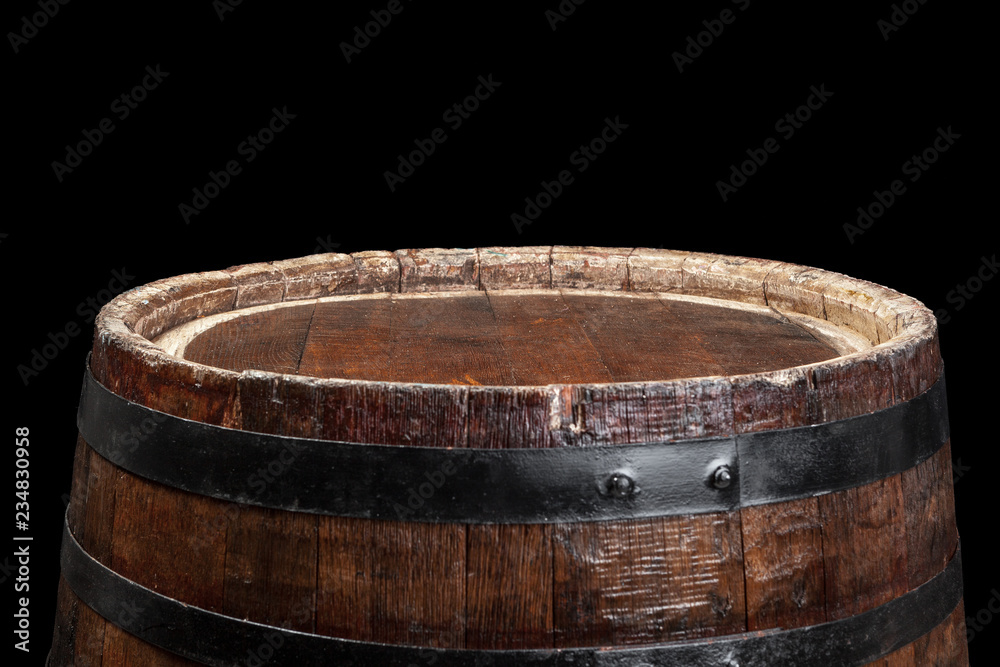 Fototapeta premium Old wooden barrel on a dark background