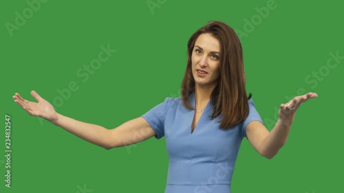 girl shows two thumb down on green screen photo