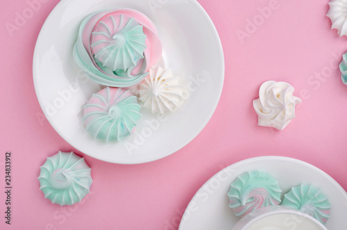 Pink turquoise meringue on a pink background.