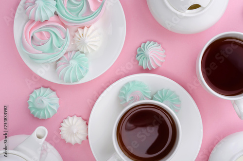 Pink turquoise meringue on a pink background. Tea party.