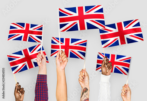 Hands waving the Union Jack photo