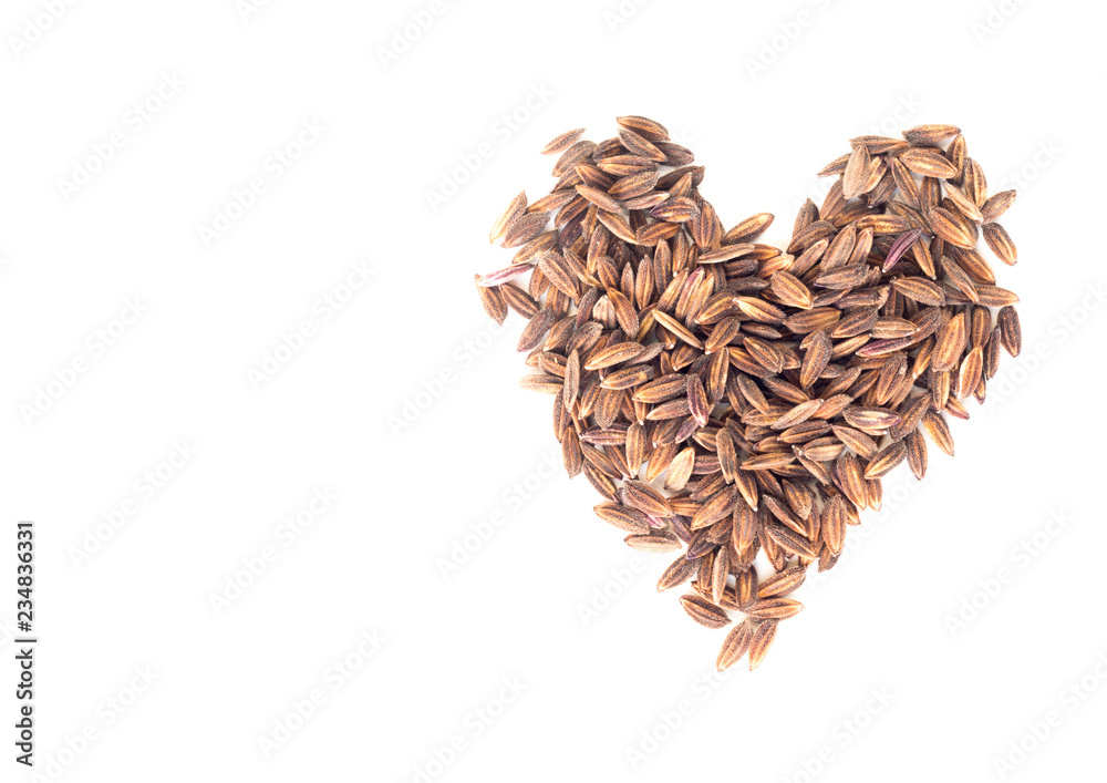 Pile of brown rice in heart shape isolated on white background Pile of brown rice in heart shape isolated on white background