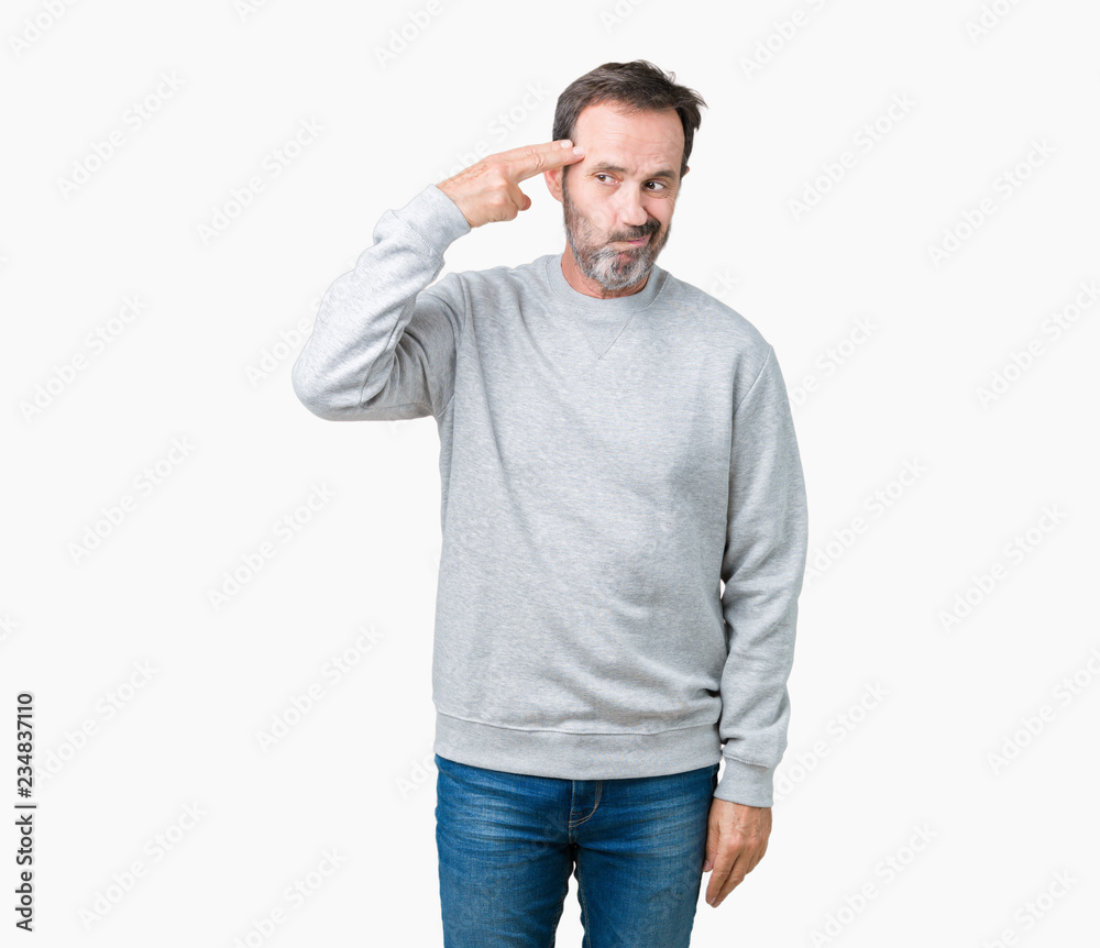 Handsome middle age senior man wearing a sweatshirt over isolated background Shooting and killing oneself pointing hand and fingers to head, suicide gesture.