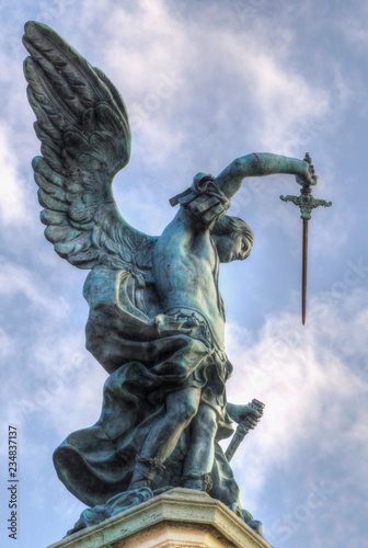 Bronze statue of Michael the Archangel, standing on top of St. Angelo's castle