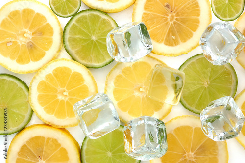 Lime and lemon slices with ice cubes