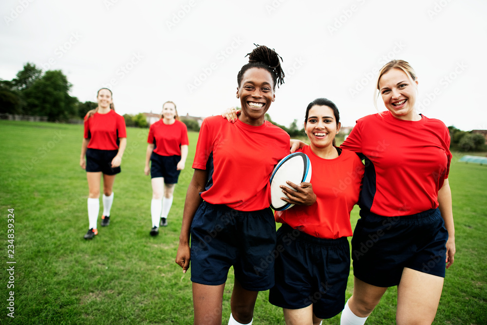 Energetic female rugby players walking together Energetic female rugby players walking together