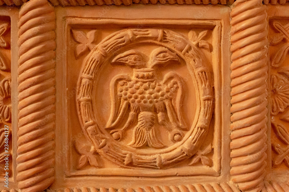 Traditional russian ornament on clay oven tiles