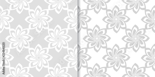 Light gray floral backgrounds. Set of seamless patterns