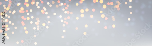 Silver shiny festive banner with golden lights.