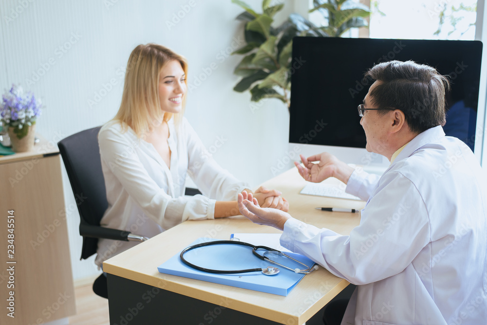 Man doctor examining to woman patient,Infertility counseling and suggestion using new technology,Physician giving a consultation and encouragement to patient,Mental health care concept