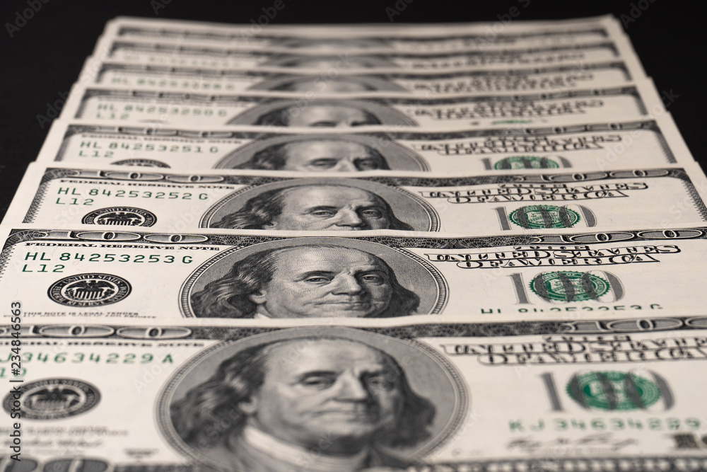 Close-up. Fan of hundred dollar bills in the center Close-up. Fan of hundred dollar bills in the center