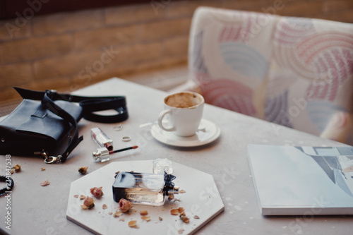 Creative flat lay composition with delicious hot coffee on table in cafe