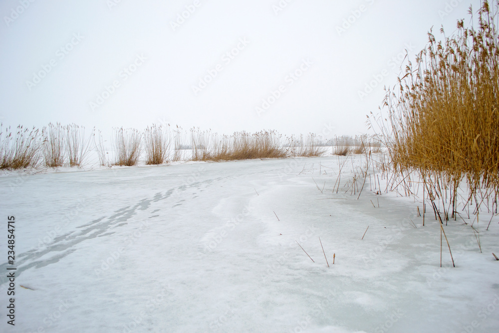 Traces of shoes on the frozen river. Traces of shoes on the frozen river.