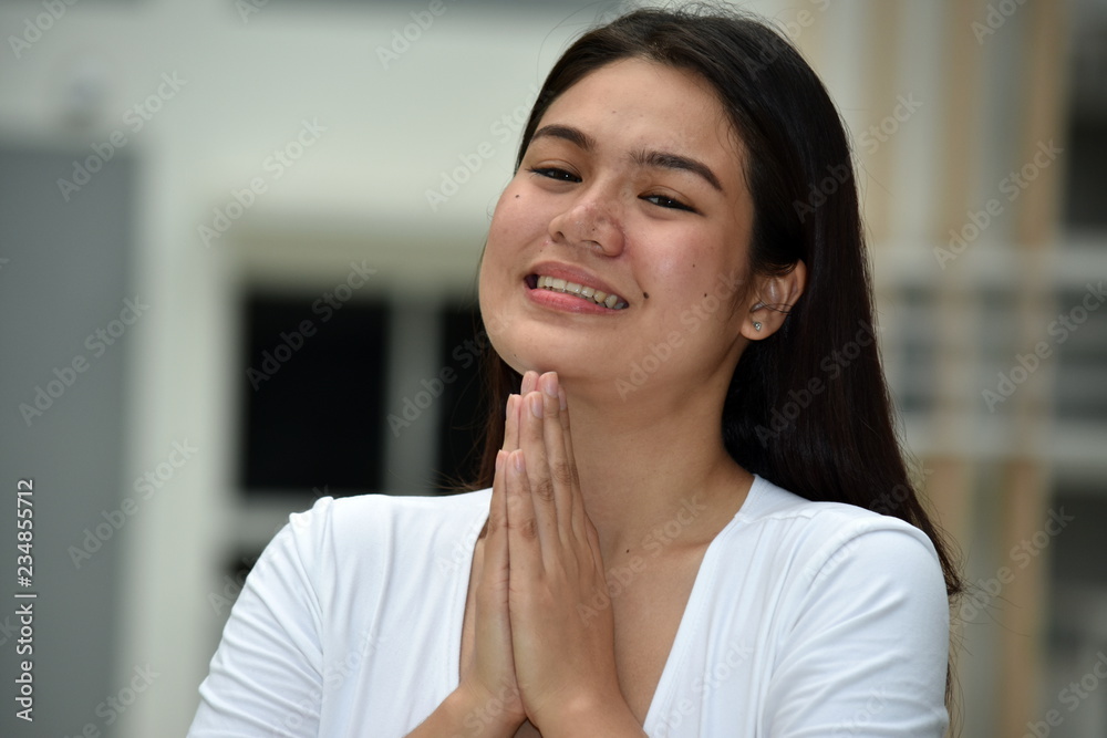 Asian Adult Female In Prayer