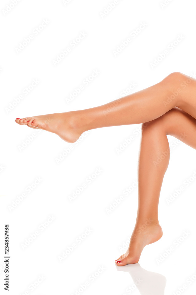 Beautiful woman legs and feet on white background Beautiful woman legs and feet on white background