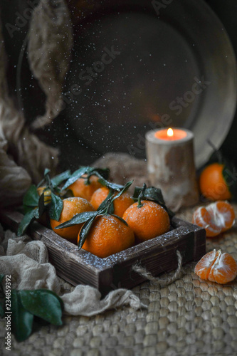 tangerines in a wooden box