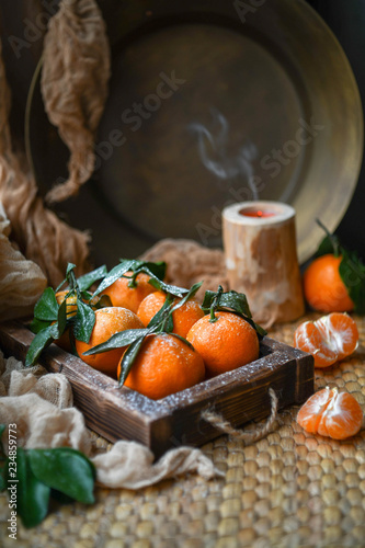 tangerines in a wooden box
