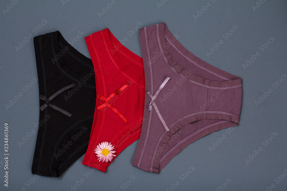 Beautiful women's cotton panties on gray background. Beautiful women's cotton panties on gray background.