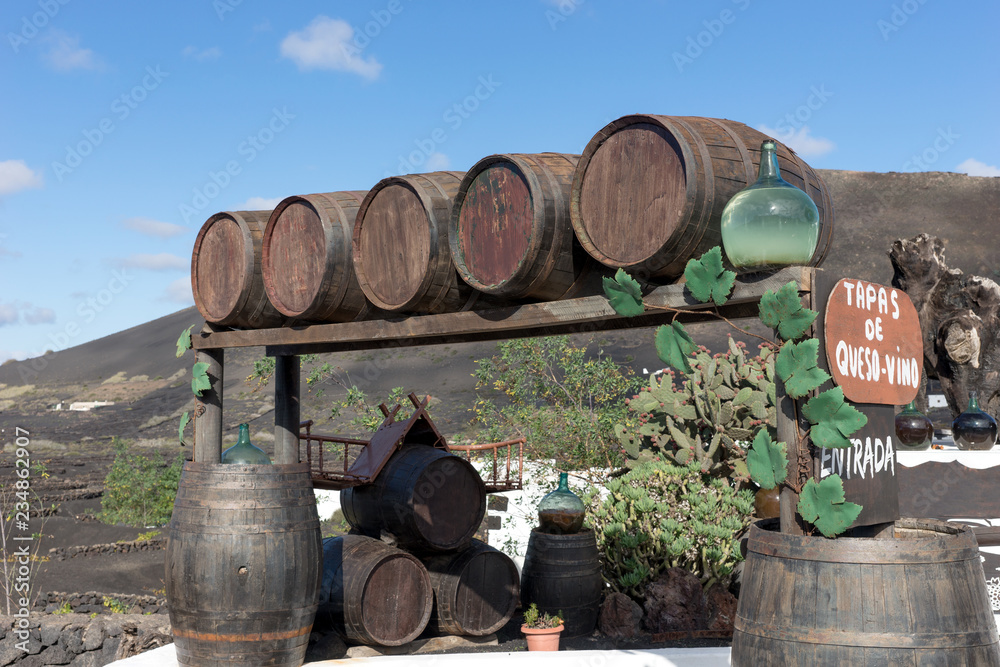 Wine barrels at the entrance of the winery. Lanzarote. Canary Islands Wine barrels at the entrance of the winery. Lanzarote. Canary Islands