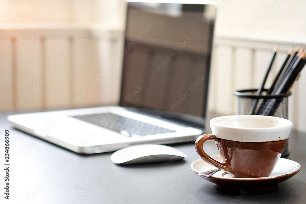 Office desk Work space stuff with notepad, laptop and coffee cup mouse notepad shot. Office desk Work space stuff with notepad, laptop and coffee cup mouse notepad shot.